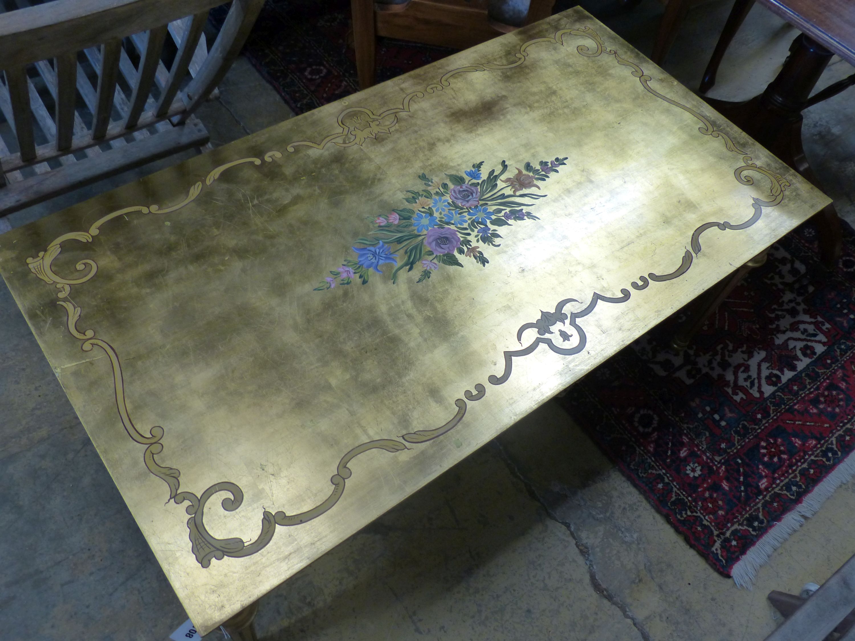 A rectangular painted gilt coffee table, width 125cm, depth 67cm, height 55cm